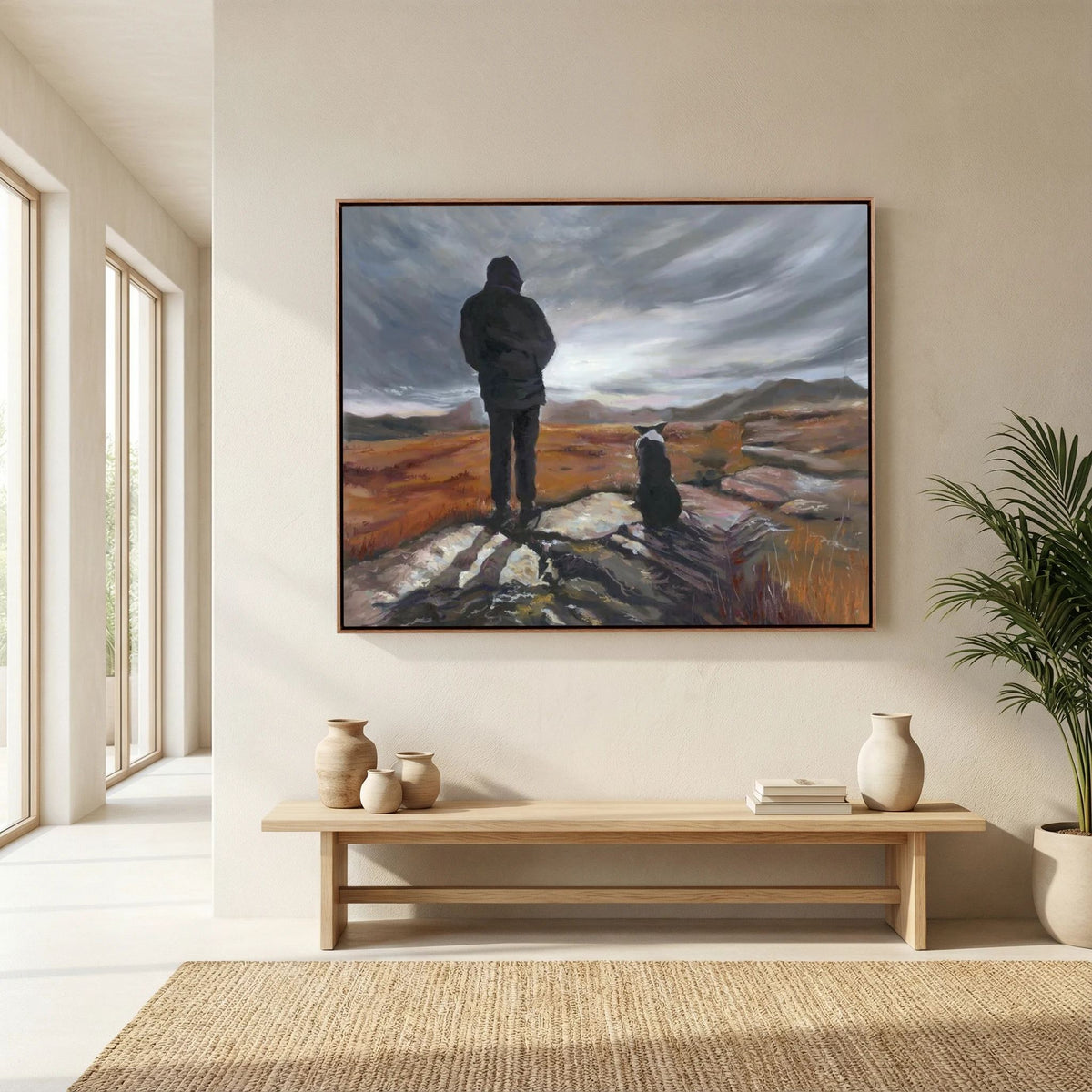 Man and His Border framed canvas print above a cream sofa in a bright living room with a wooden coffee table.