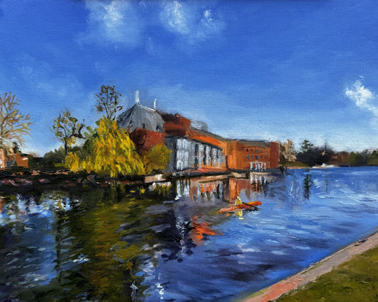 Original oil painting of the Royal Shakespeare Theatre reflected in the River Avon in Stratford-upon-Avon under a bright blue sky