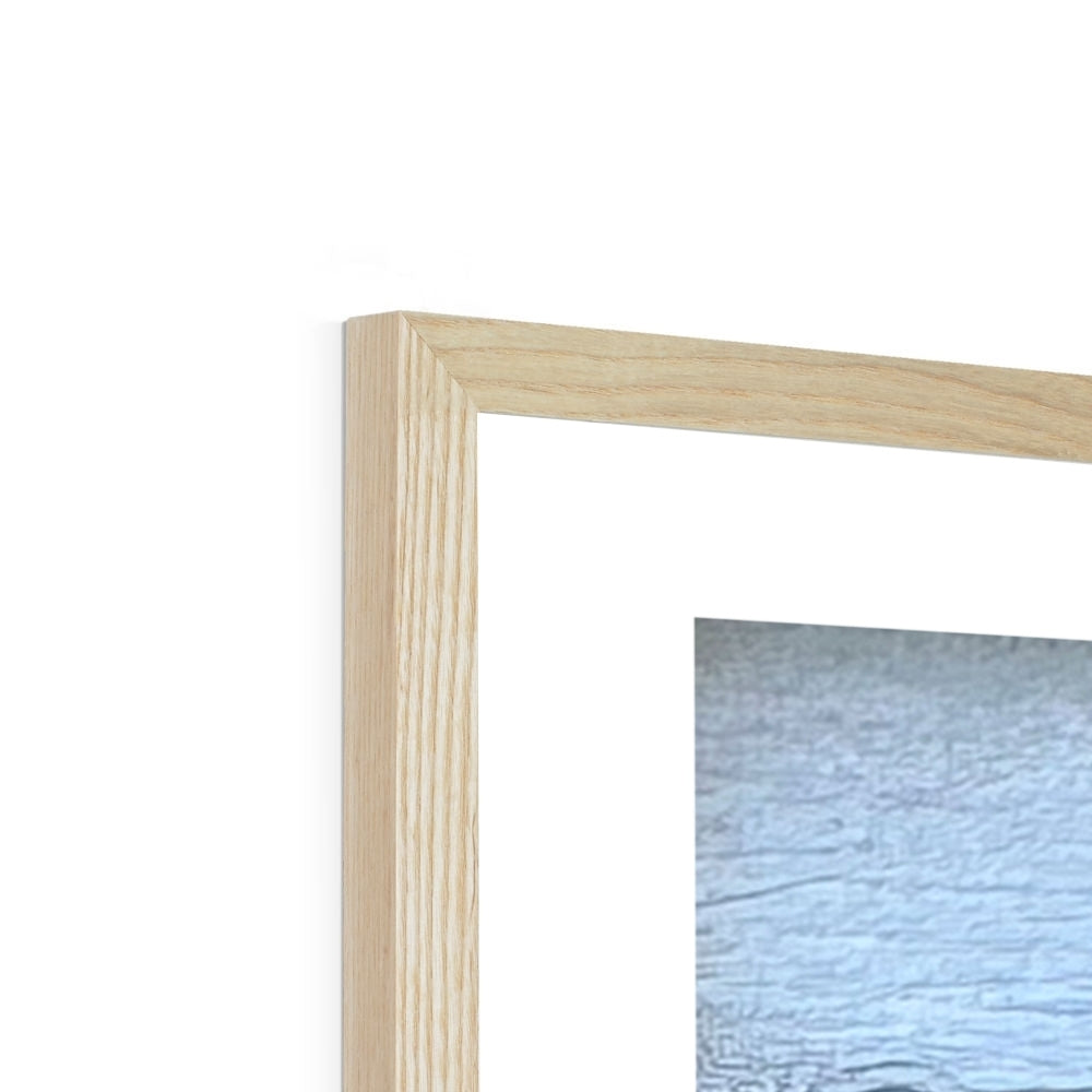 Close-up of the natural wood frame corner on the “Serenity’s Glide” swan fine art print, showing the warm organic grain and fine craftsmanship.
