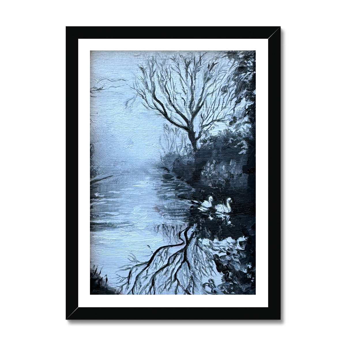 “Serenity’s Glide” swan fine art print in a black frame, featuring cool blue reflections, winter trees, and a calm atmospheric scene inspired by peaceful riverside walks.