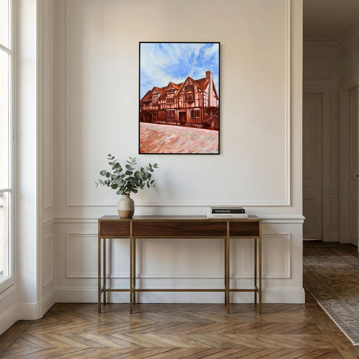 Canvas print of Shakespeare’s Birthplace displayed above a console table in a neutral interior