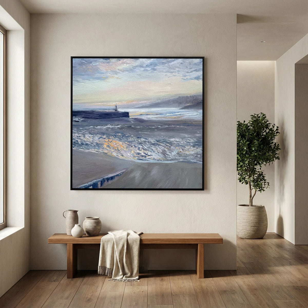 Framed St Ives Harbour Sunrise canvas print displayed above a wooden console table beside a window.