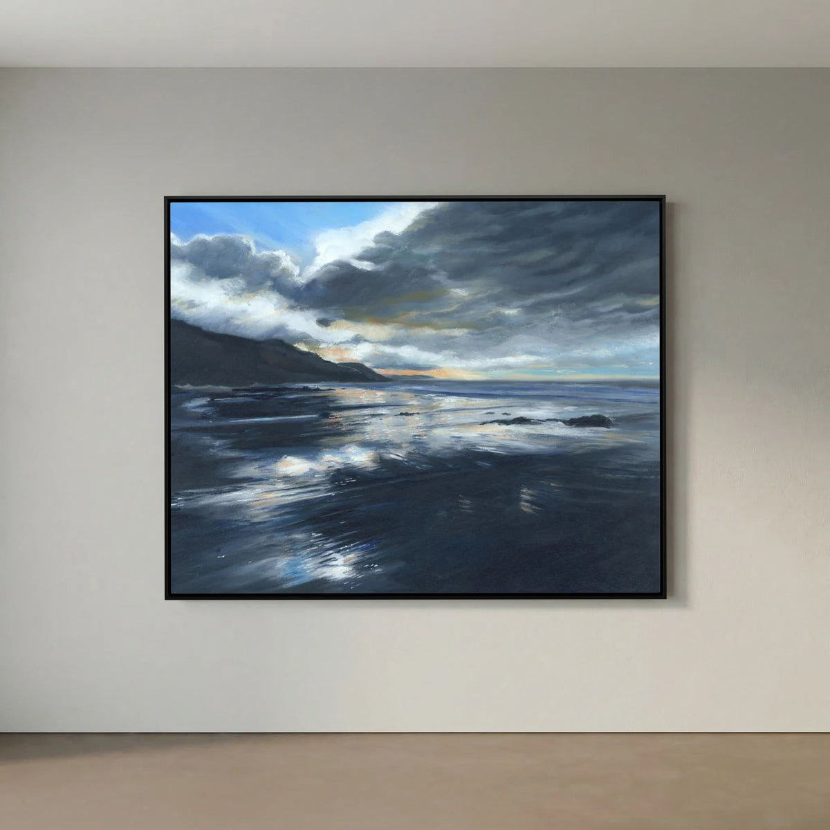 Stormy Seas framed canvas print displayed on a plain grey wall, showing waves beneath dramatic clouds.