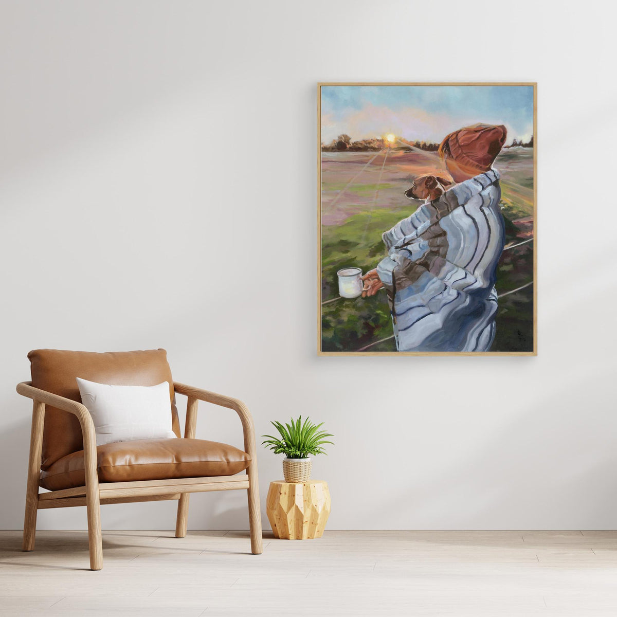 Sunrise With the Pup canvas Jack Russell print on a light wall beside a wooden armchair and a small potted plant.
