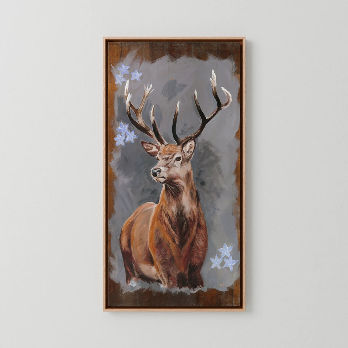 The Stag red deer canvas print shown in a natural wood frame