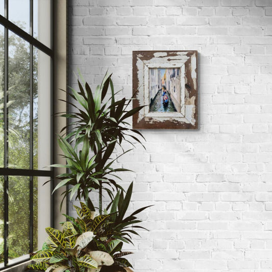 Original Venice gondola oil painting by Lorraine Field Art displayed on a white brick wall in a bright contemporary room