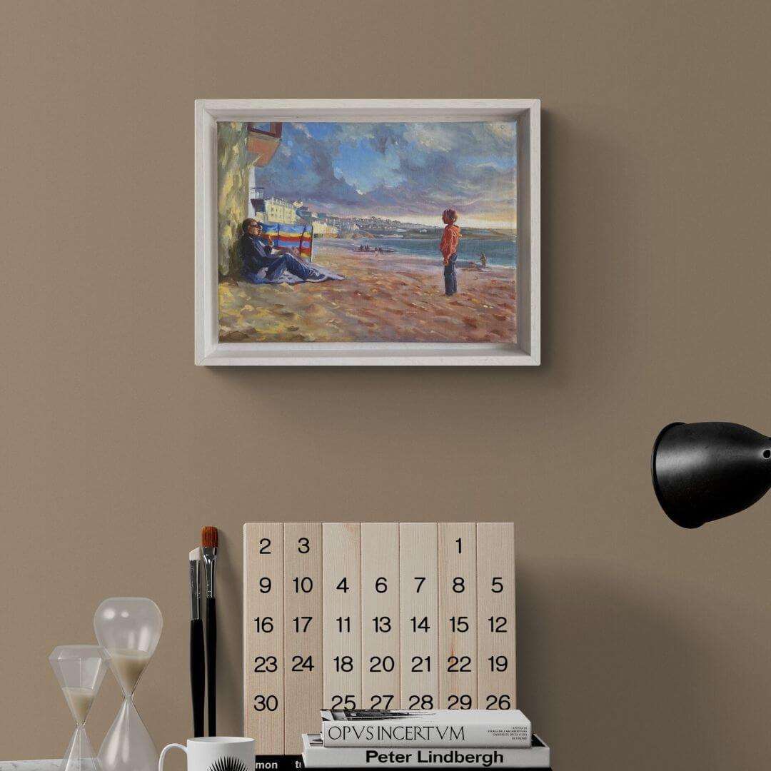 Will You Play? oil painting by Lorraine Field in a white frame above a desk on a taupe wall.