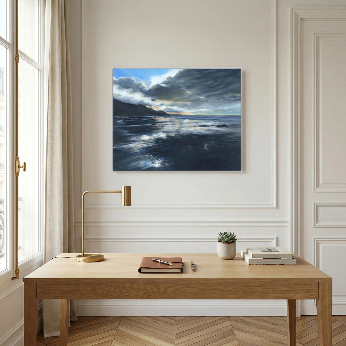 Stormy Seas canvas print above a wooden console table against a white panelled wall.