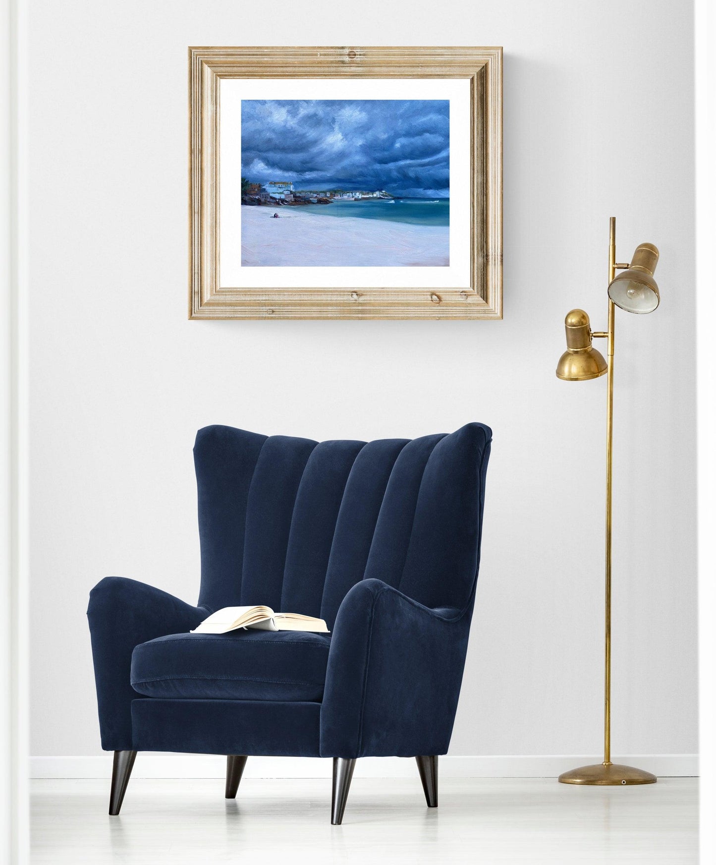 Framed St Ives coastal painting displayed in elegant living room interior.