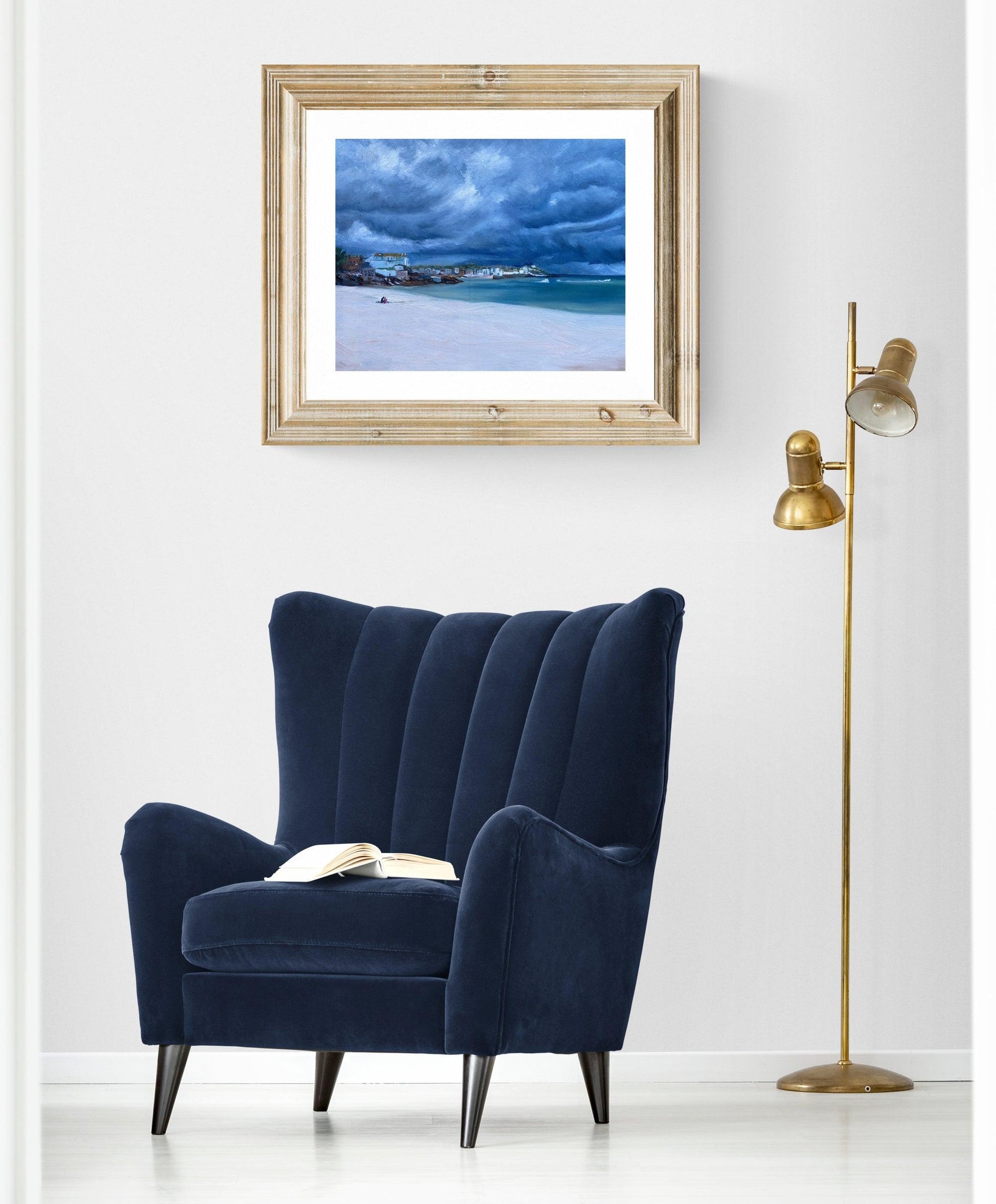 Framed St Ives coastal painting displayed in elegant living room interior.