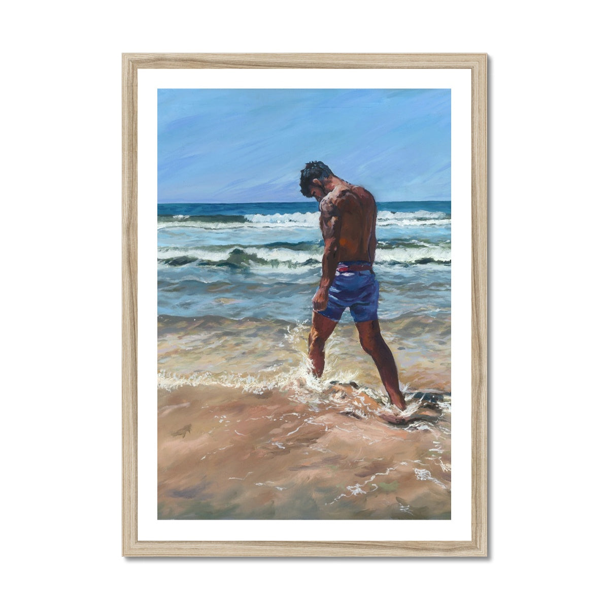 Story-rich coastal artwork showing a solitary figure walking through foamy surf, presented in a natural wood frame. Warm Cornwall beach wall art inspired by reflection and memory.
